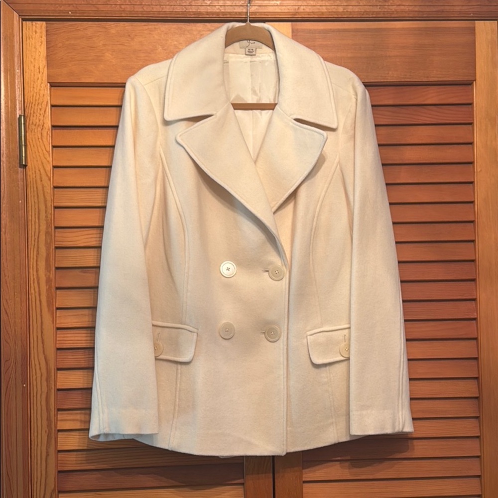 NEW with tags removed. Cream colored peacoat.